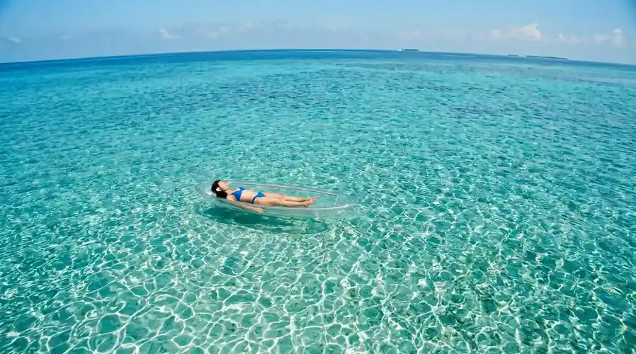 Kayaking activity in the calm crystal clear waters Luma Selakan